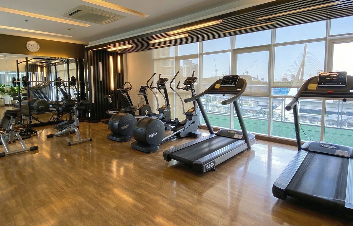 Fitness room with river-bridge view, The Coast Bangkok